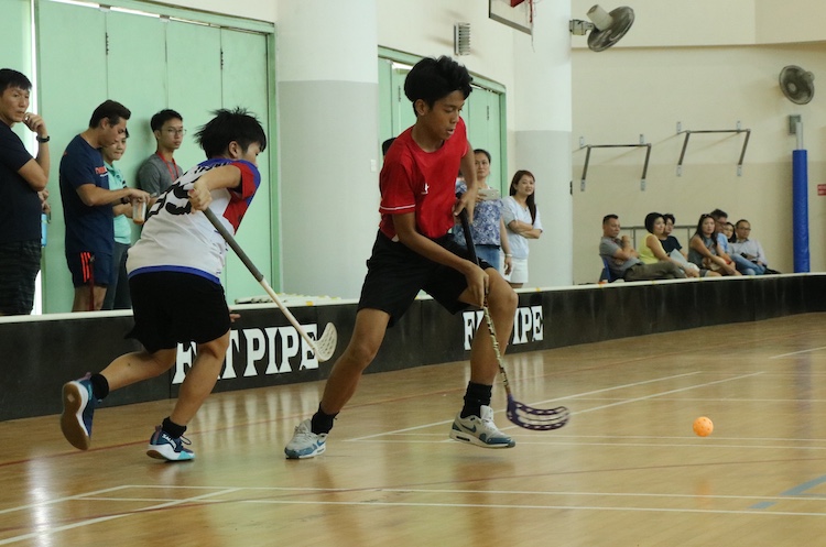 Muhamad Shafrizan (YHS #13) of Yuhua Secondary caught in action as he chases after the ball.