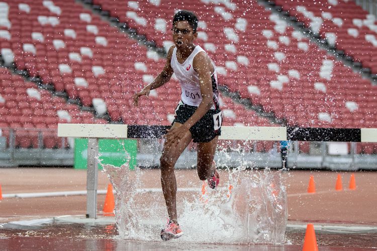 Ruben S/O Loganathan (#1) of ASRJC finished first in the A Division Boys' 3000m steeplechase final with a time of 10:24.85.