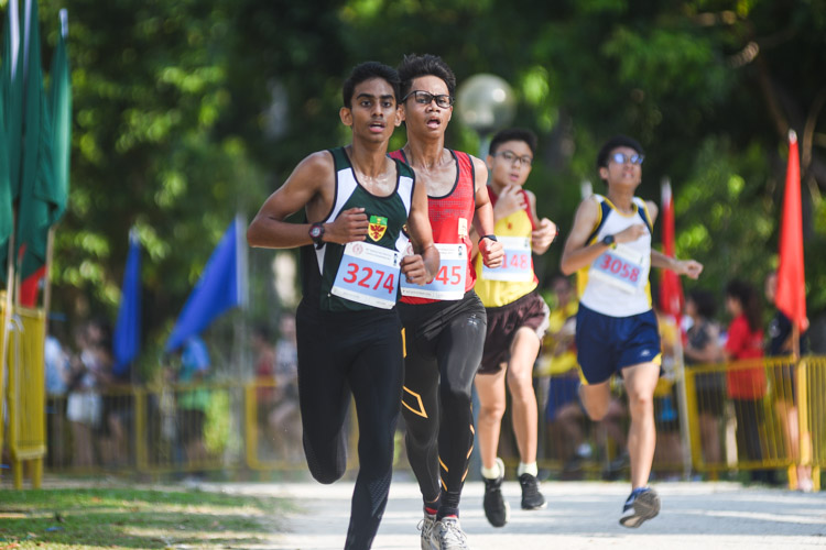 RI's Hiren Koban (#3274) finished 13th while Bukit Batok Secondary's Letrodo Rojean Macabenta (in red) placed 14th in the Boys’ B Division cross country race with times of 17:54.4 and 17:54.8 respectively. (Photo 1 © Iman Hashim/Red Sports)