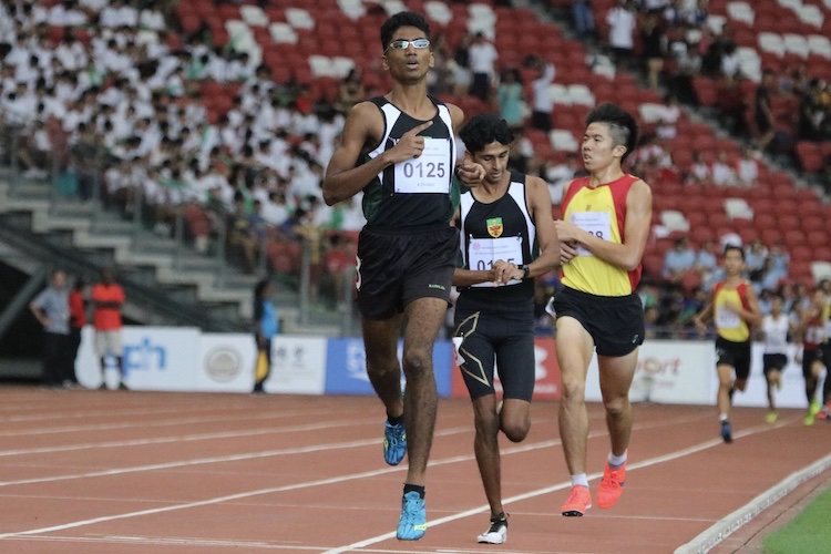 Nedunchezian Selvageethan of Raffles Institution takes home the gold for the A division 1500m race.(Photo 2 © REDintern Julianna Jothi)