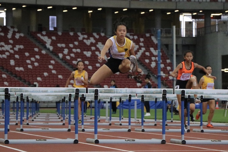 Elizabeth-Ann Tan came in first place with a timing of 14.59s and set a new record for the B division girls 100m hurdles.