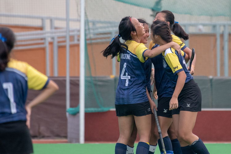 The EJC girls celebrate after captain Valerie Koh's (#17) winning penalty goal.