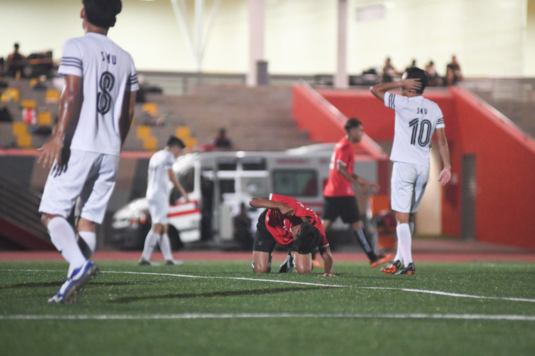 Syukri Noorhaizam (TP #11) beating the ground after missing a chance in front of goal. Temasek Polytechnic cruised to a 5-0 win over Singapore Management University to book their place in the semi-final of the Institute-Varsity-Polytechnic football tournament. (Photo 1 © Stefanus Ian/Red Sports)
