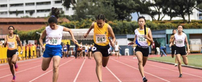Cedar Girls' Caelyn Chew (#45) anchors her team to gold in the C Div girls' 4x100m relay final in 52.36s, as CHIJ St. Nicholas Girls’ School took the silver and Nanyang Girls' High School the bronze. (Photo 1 © Iman Hashim/Red Sports)