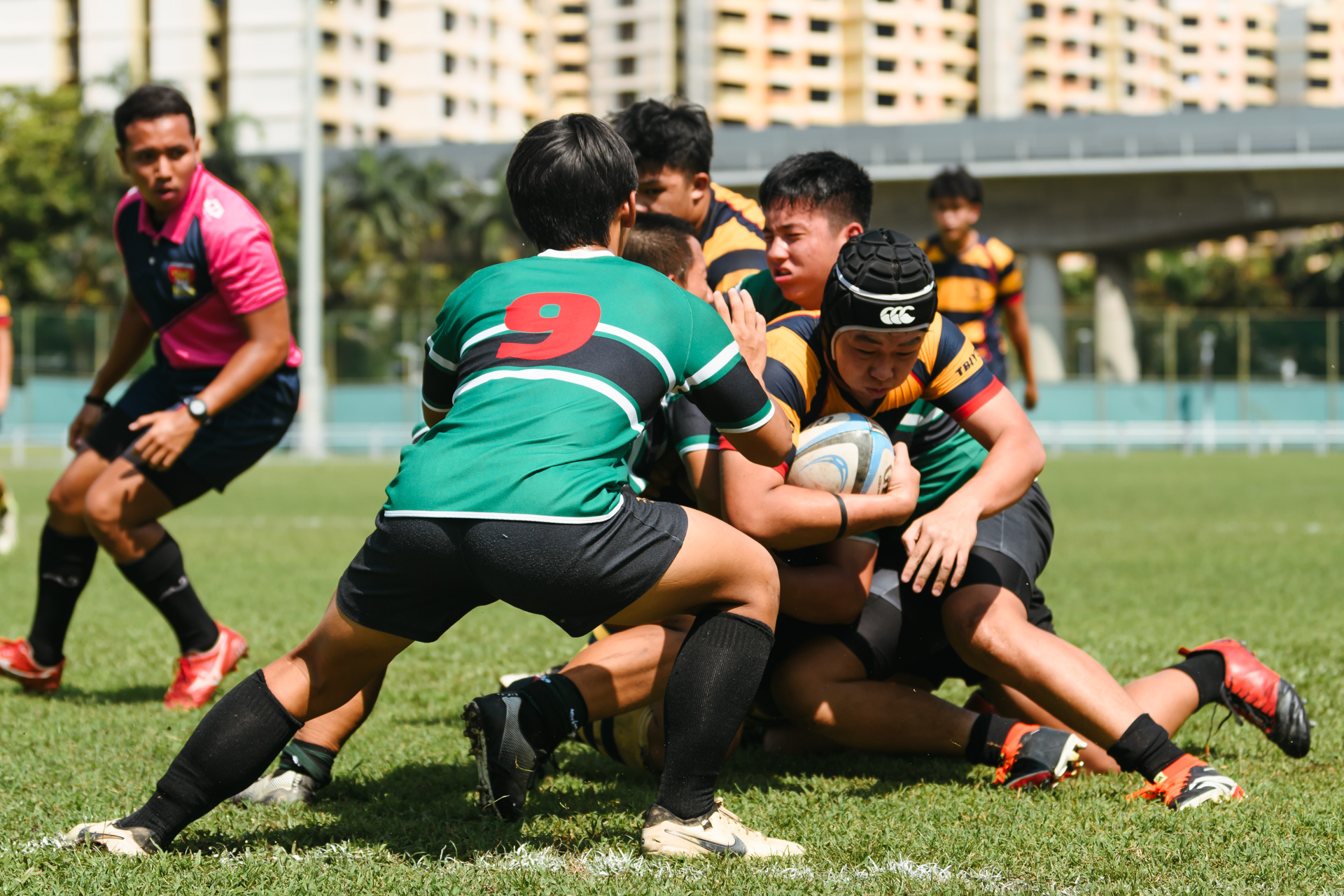 An ACS(I) player gets stopped just short of the try line. (Photo 9 © Joash Chow/Red Sports)