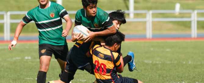 RI’s Daniel Park (#10) gets caught in a double team effort. (Photo 21 © Joash Chow/Red Sports)