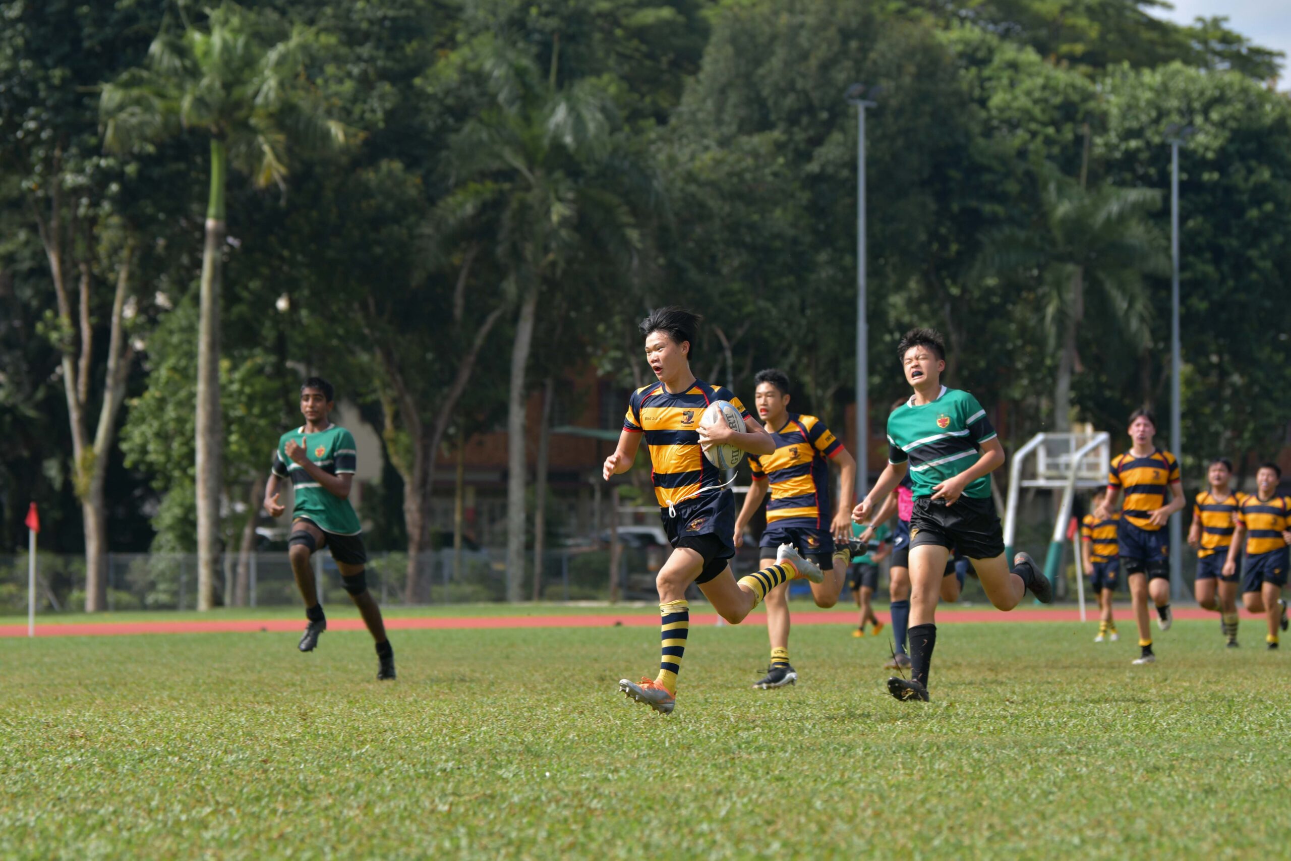 Ashwyn Wong (AC #47) dashes for the line for the final try of the semi-final. (Photo X © Joash Chow/Red Sports)